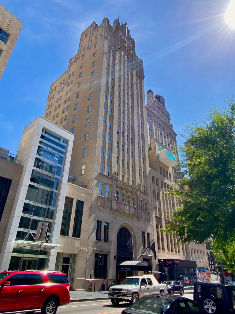 Street view of the Joule Hotel Dallas and its famous pool hanging over the street.